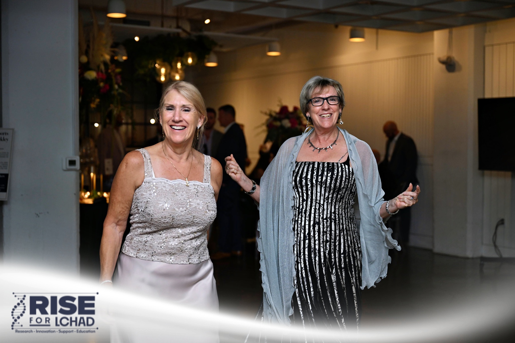 Two guests arriving at the Fueling Hope Gala