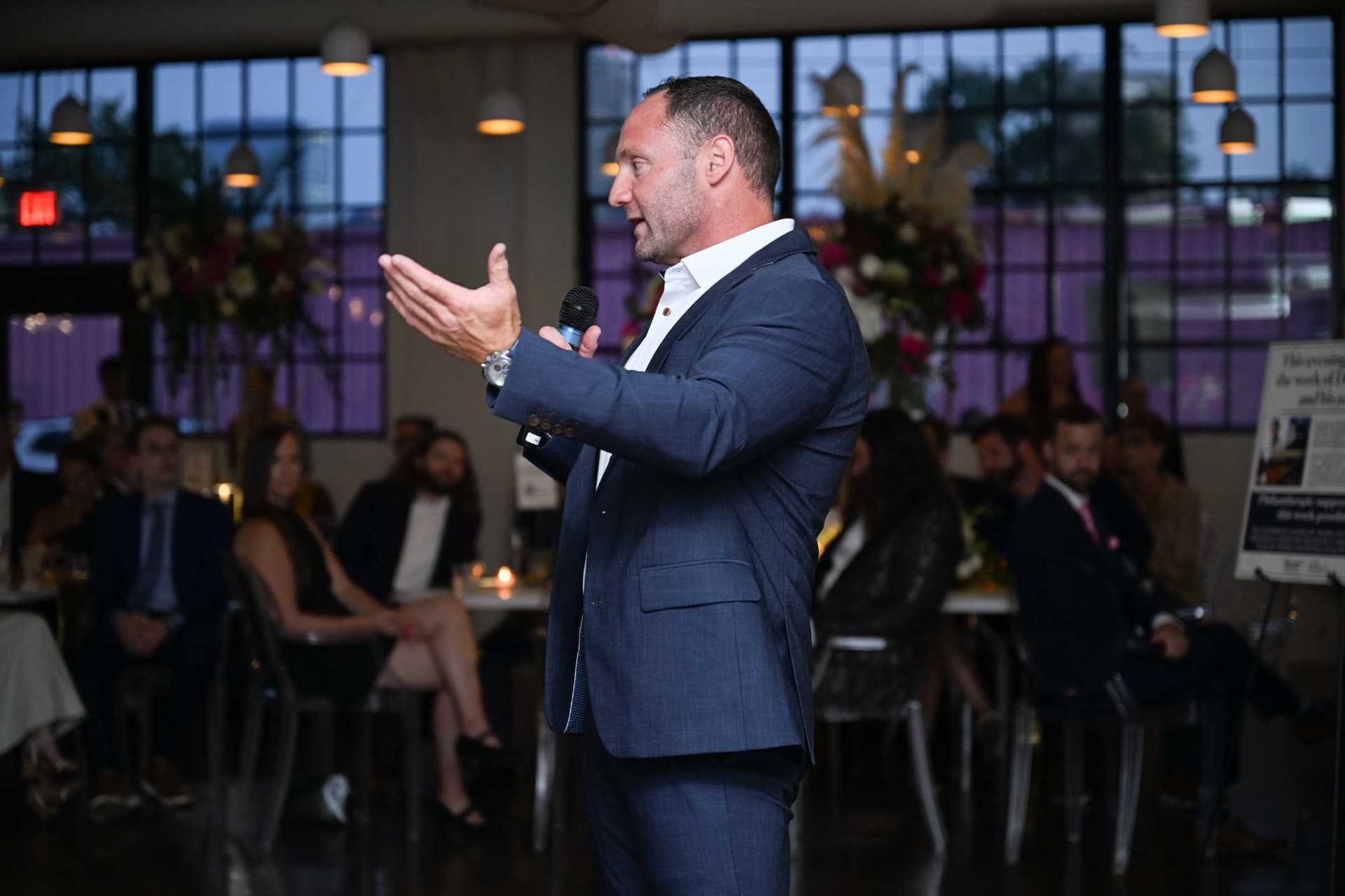 Speaker addressing guests during the gala program