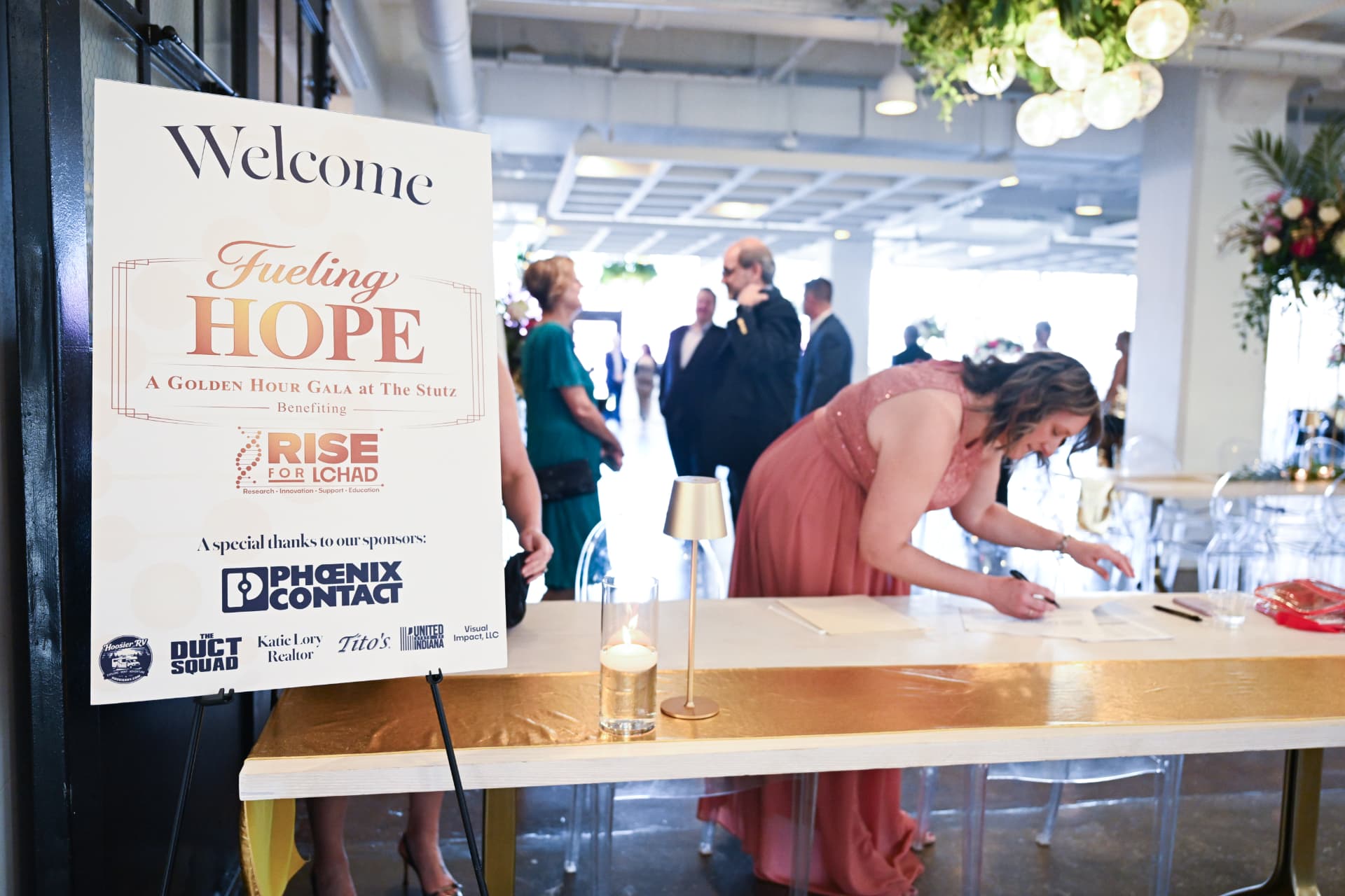 Welcome sign and guest check-in at Fueling Hope