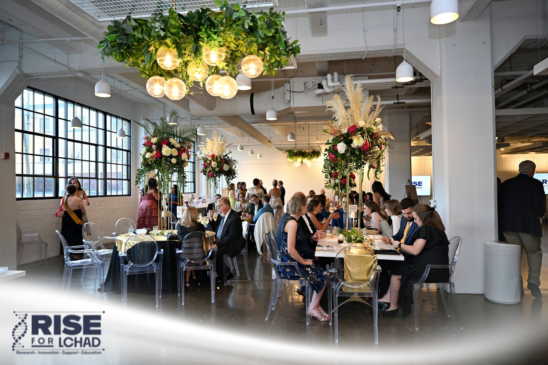 Tables set with florals in the Stutz event space
