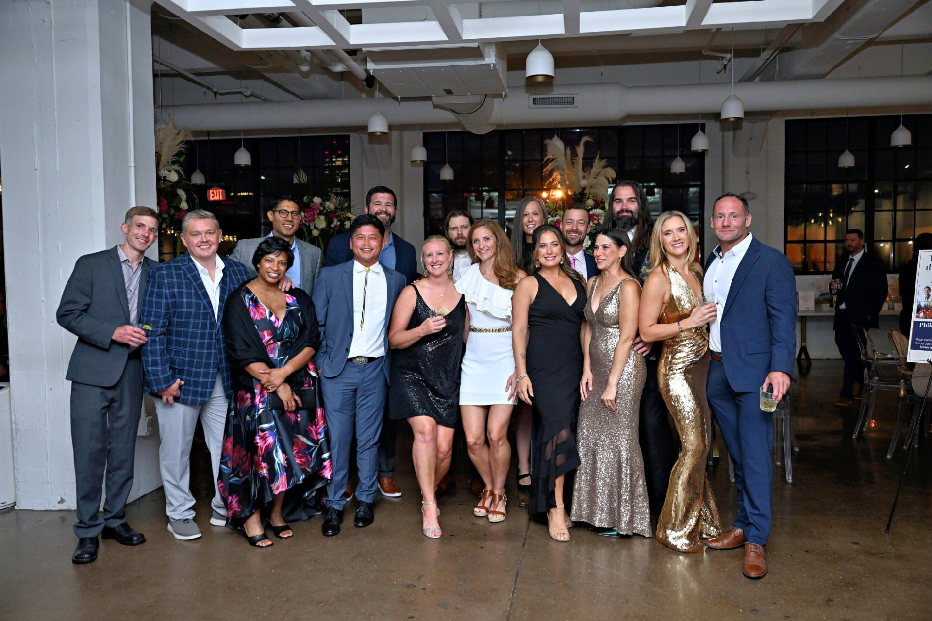 Large group of attendees celebrating at the gala
